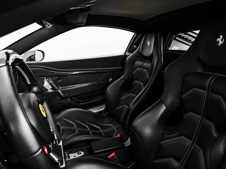 cleaning leather seats in a luxury car