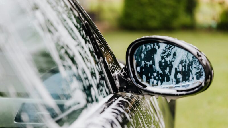 A car being washed by a trustworthy mobile detailing company found on MobileDetailingBiz directory