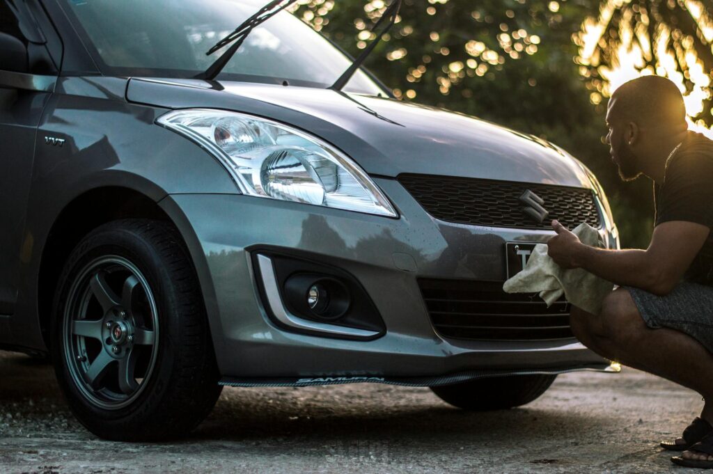 a man detailing his car